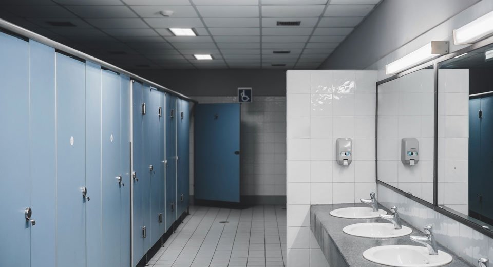 a public restroom with toilets
