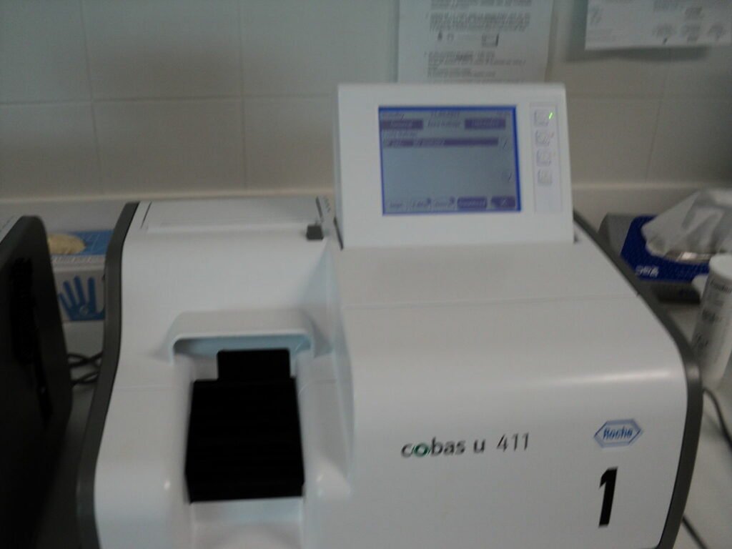 A white and black colored Autoanalyzer